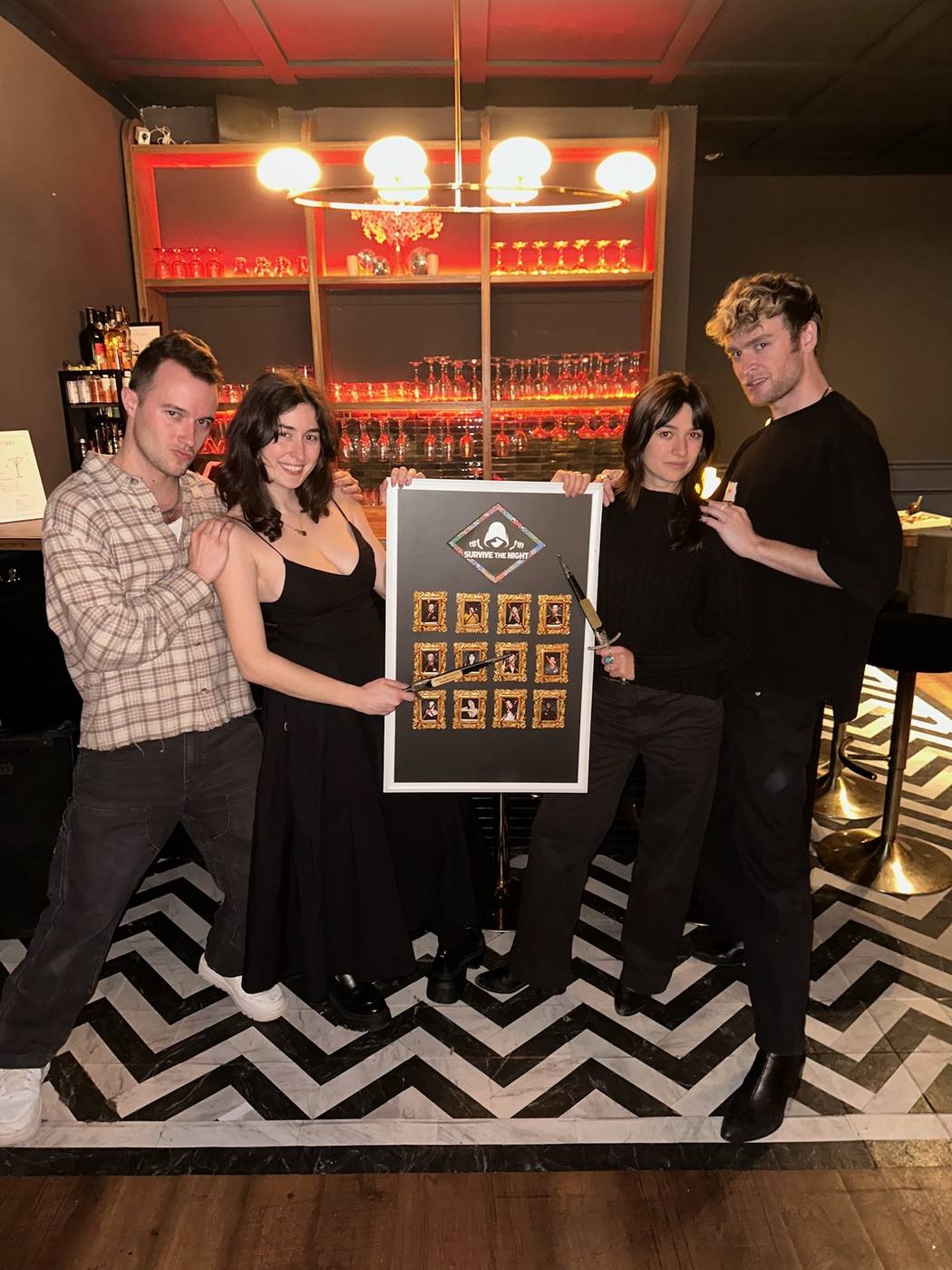 Survivors holding the elimination board